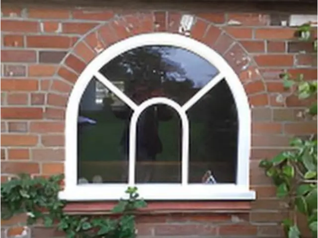 Round-headed window with fanlight glazing bars